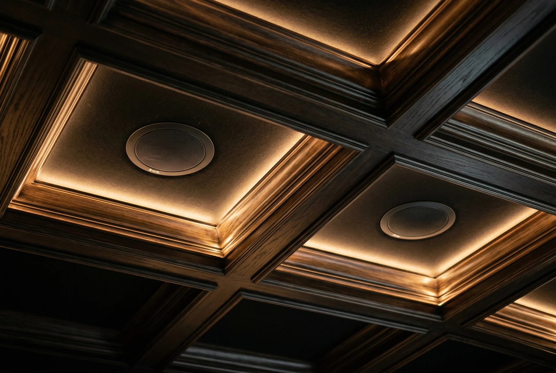 Ceiling-mounted Atmos height speakers in coffered ceiling of Scottsdale home theater