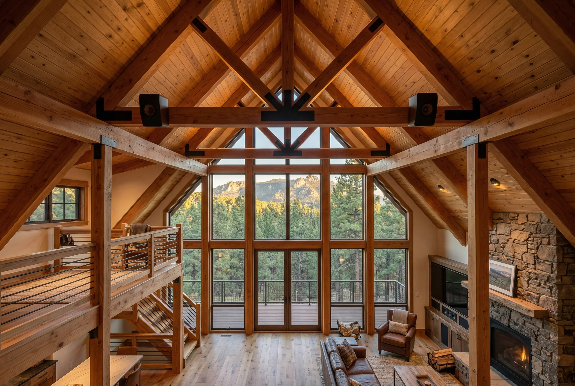 Open loft A-frame interior with soaring vaulted ceiling showing speaker placement solution in Prescott Arizona