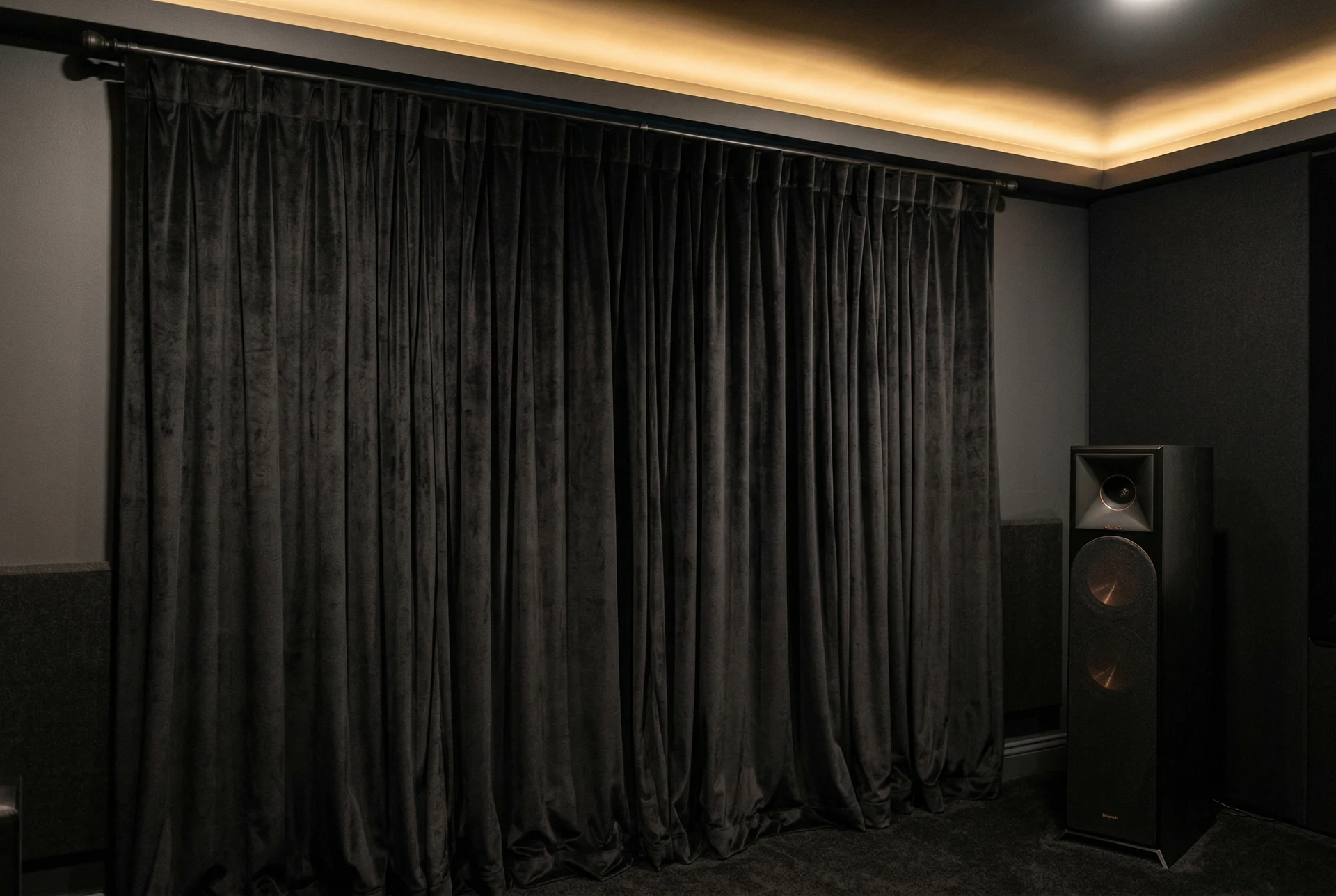 Blackout curtains and tower speaker in converted Scottsdale home theater room