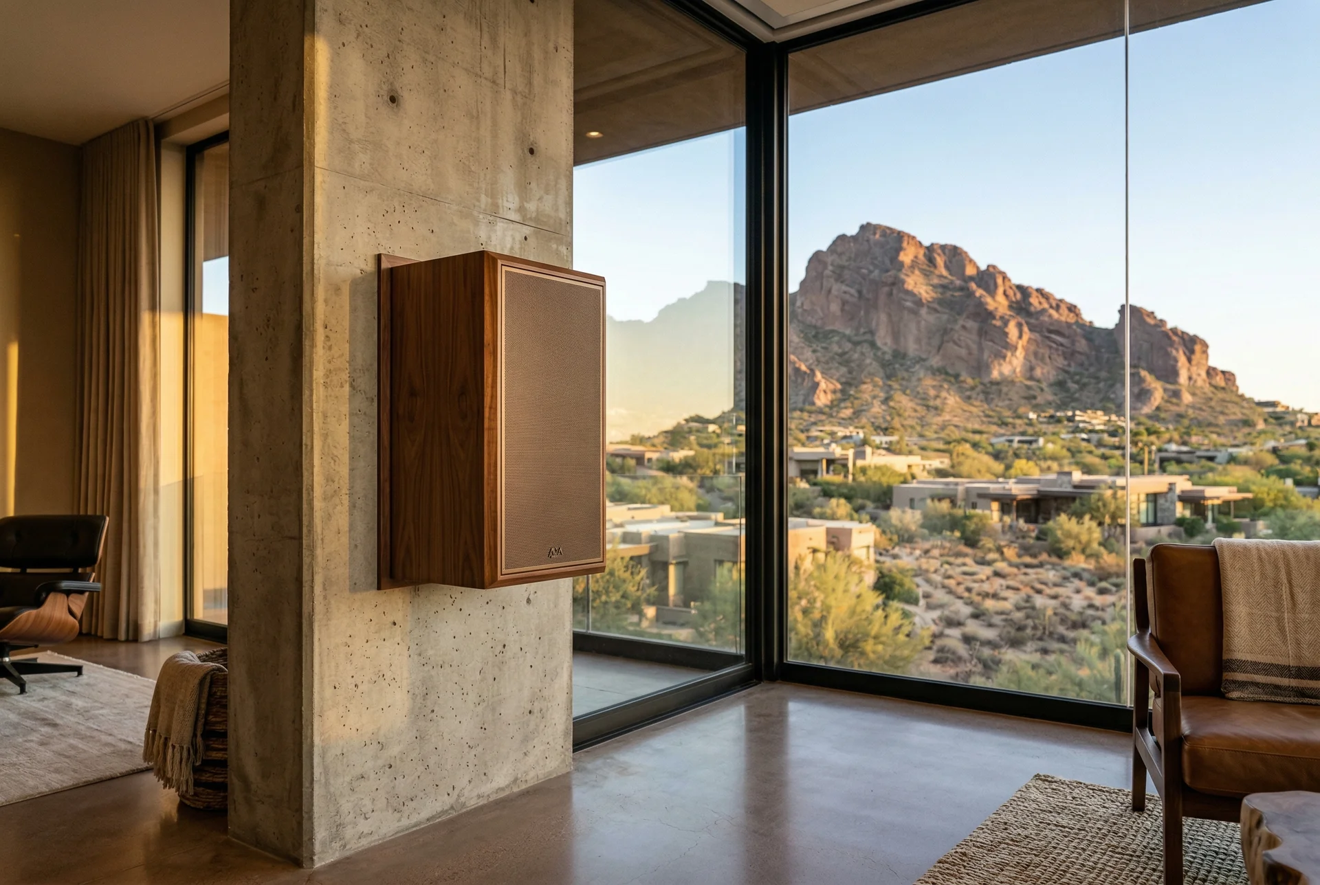 Close-up of custom on-wall speaker with high-end finish matching room decor in Paradise Valley Arizona home